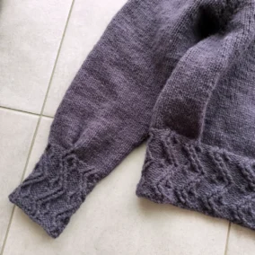 Lattice sweater lying flat showing details